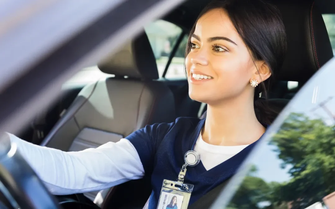 A registered nurse driving a car.