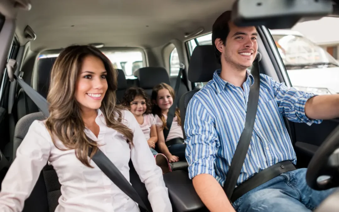 A man driving his family after successfully reinstating his driving license.