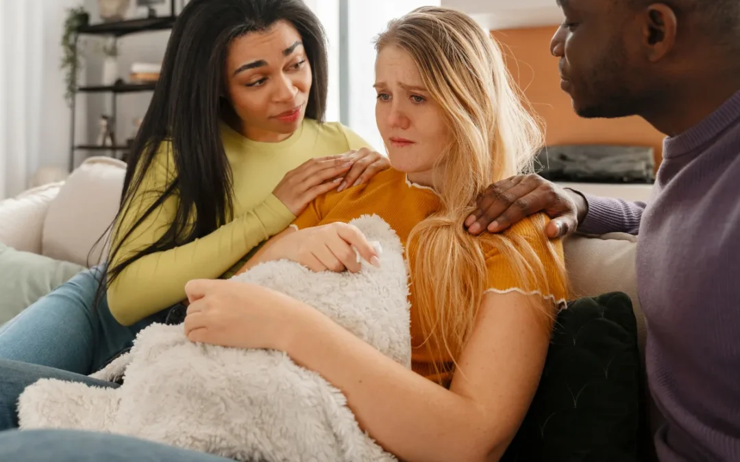A girl worried about her DUI charge but was being comforted by her two friends.